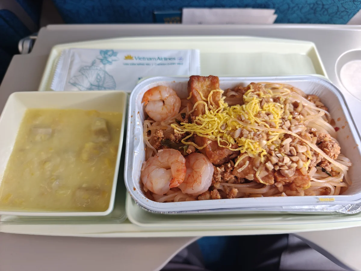 Pad Thai at 30,000 feet — Vietnam Airlines' contribution to the ongoing debate about whether airplane food can be redeemed by sheer audacity of dish choice.