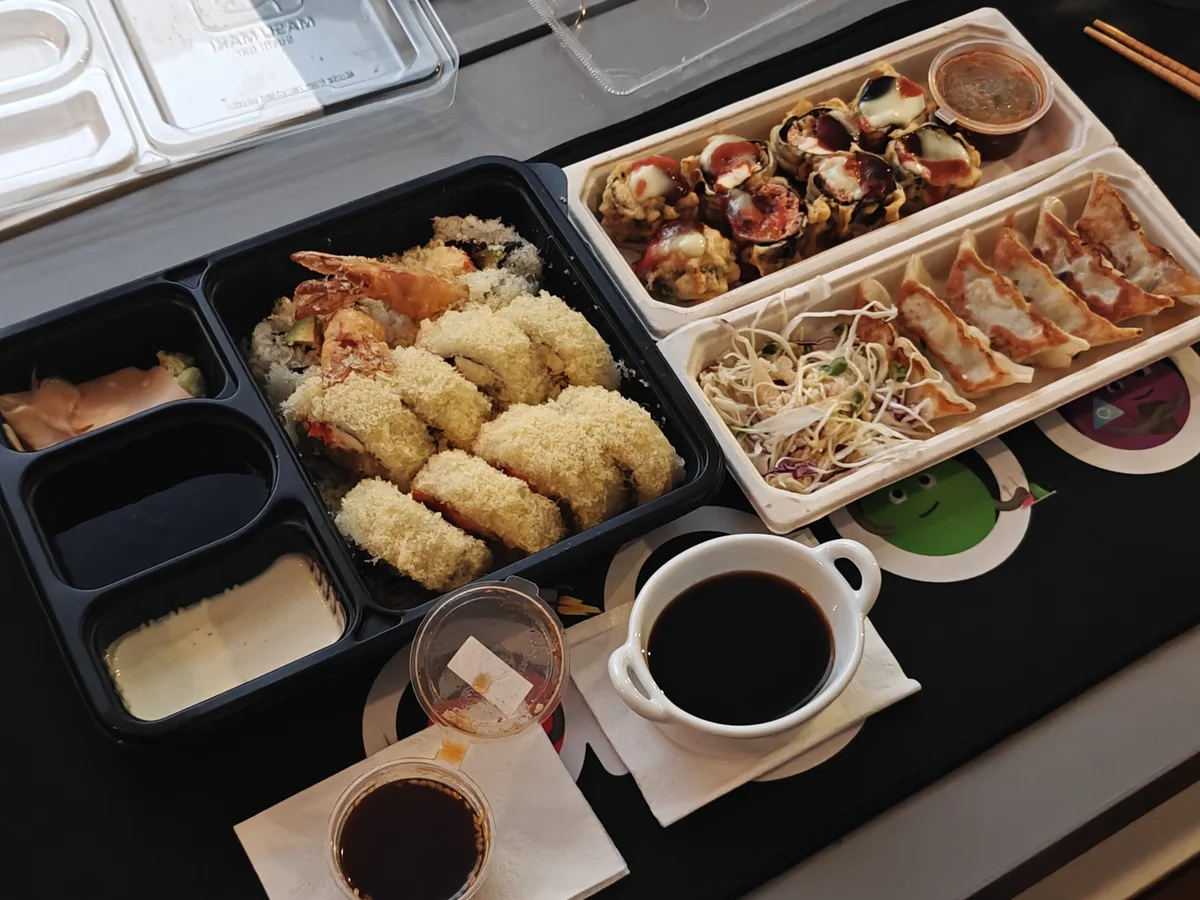 Ordered "a little something" and somehow summoned an entire Japanese restaurant onto a conveyor belt table.