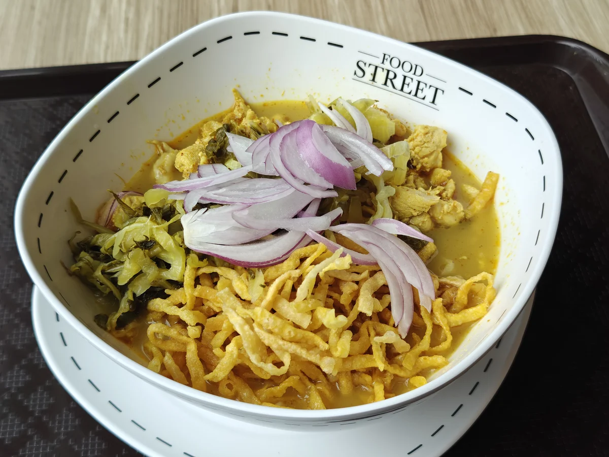 Khao Soi, lunch, Bangkok. Curry broth, crispy noodles, pickled mustard greens, raw shallot. Nothing missing.